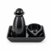 Zwarte keramische massageset met massagebol, houder, kommetje en rechthoekige schaal.