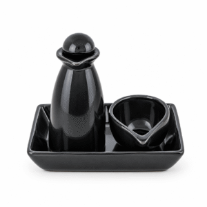 Zwarte keramische massageset met massagebol, houder, kommetje en rechthoekige schaal.