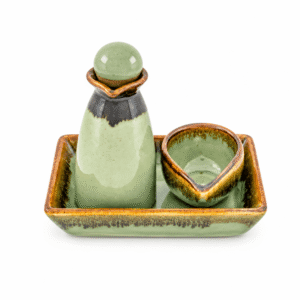 Groene keramische massageset met massagebol, houder, kommetje en rechthoekige schaal.