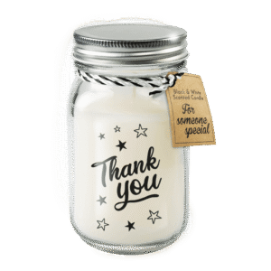Witte geurkaars in glazen pot met metalen deksel en de tekst “Thank you”, voorzien van een cadeaulabel.