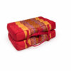 Opvouwbaar meditatiekussen rood-geel, compact opgevouwen met draaglinten